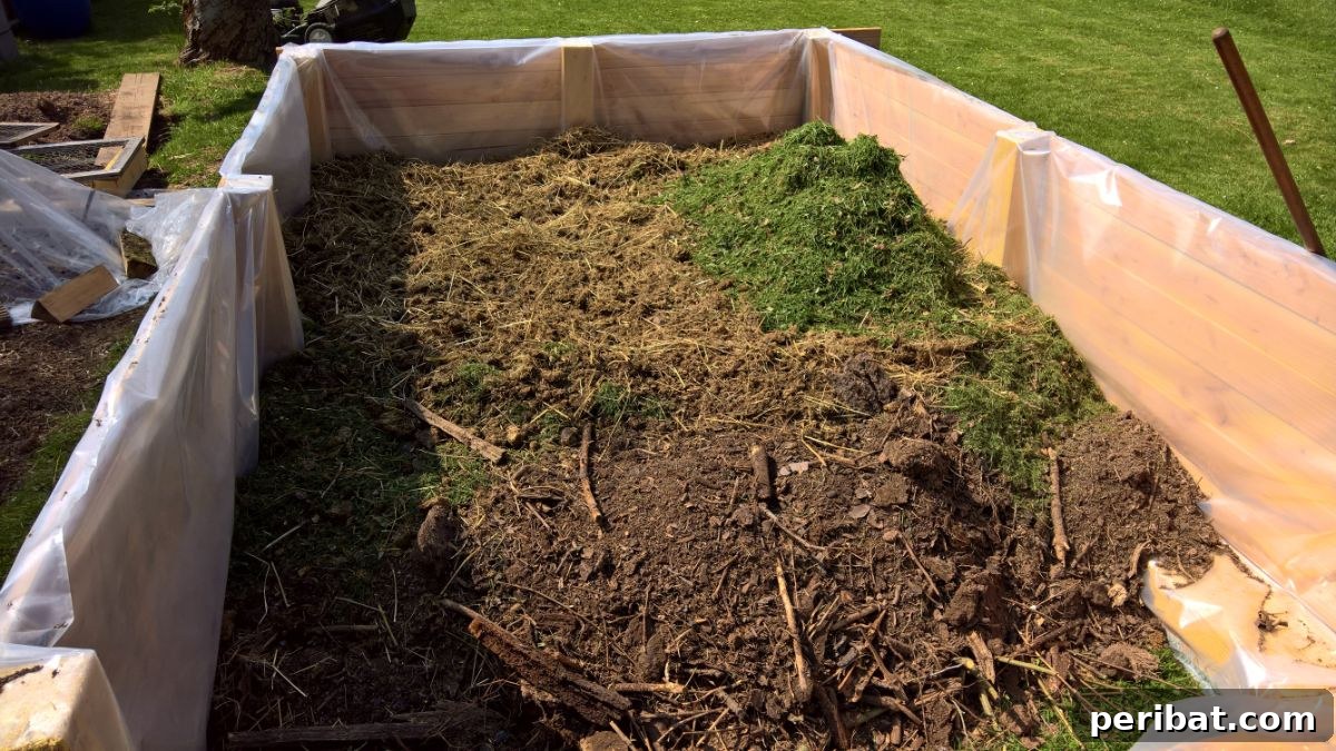 raised bed with grass, compost and branches 