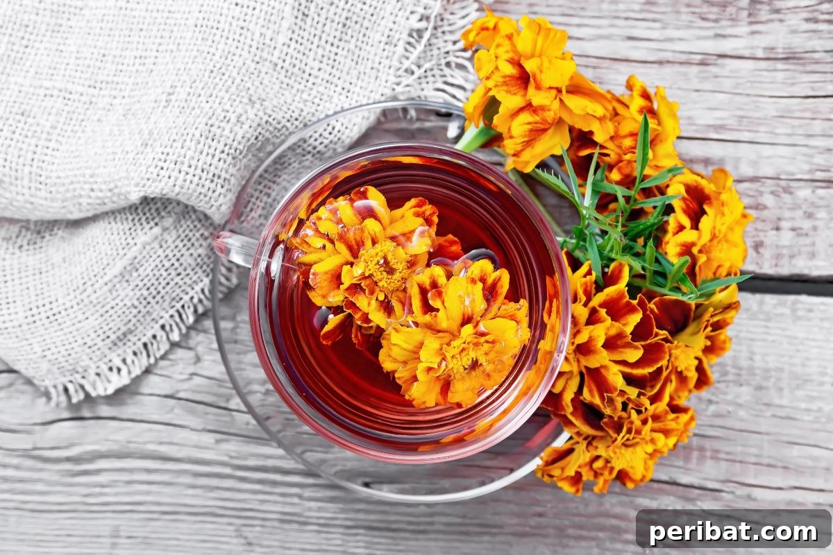 marigold flower soaked in a bowl of water with a cloth fabric beside