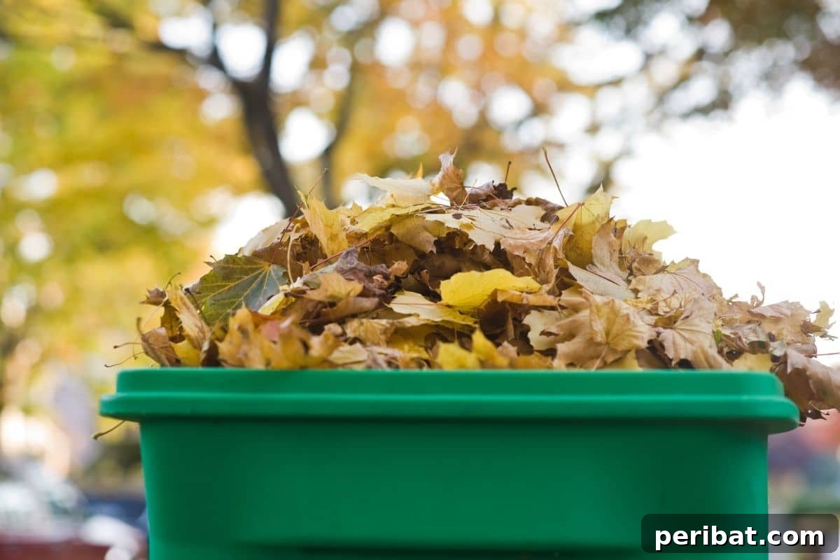 Compost pile made from dried leaves during autumn in a rustic compost bin