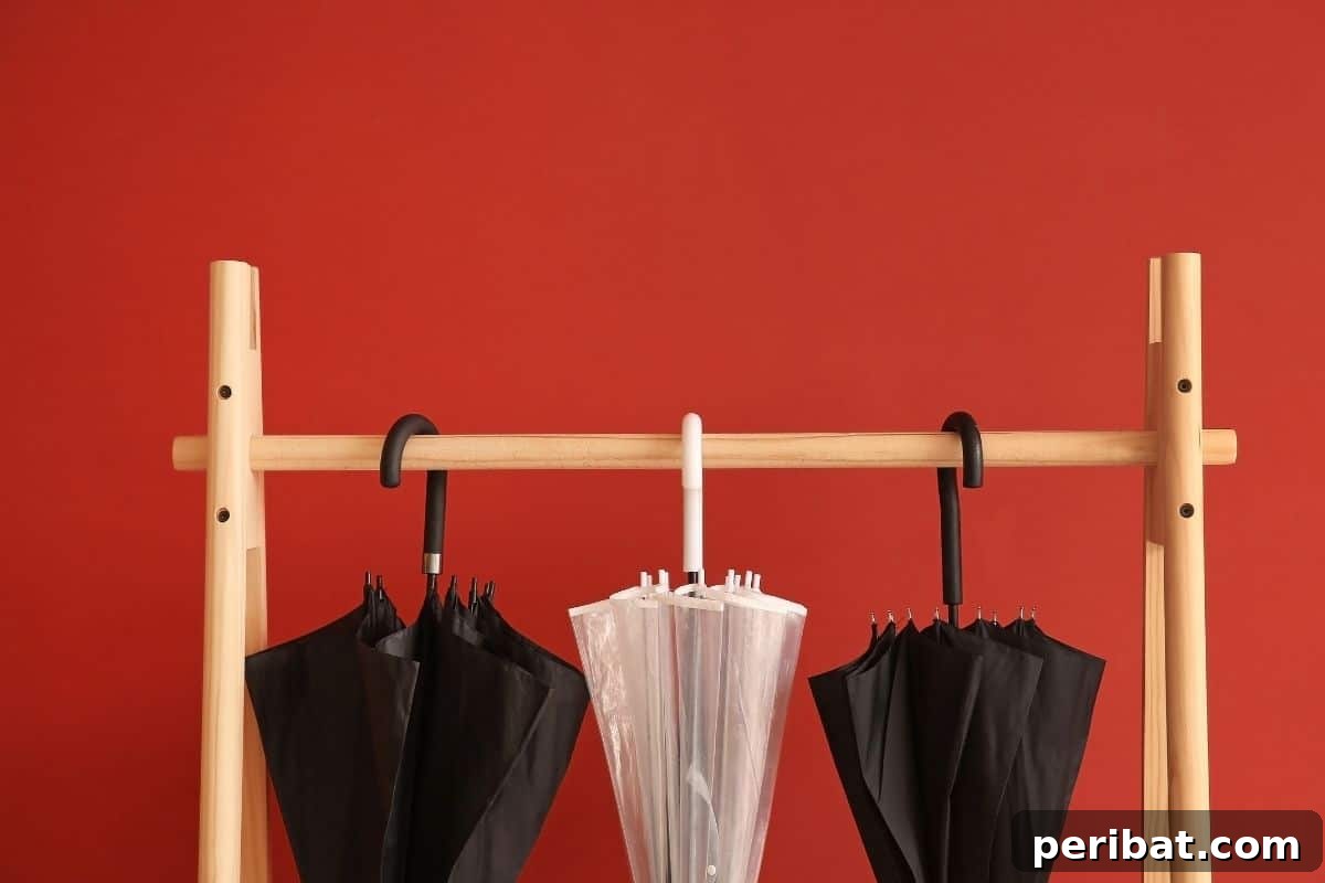 Vertical Oasis: 18 Creative Hanging Plant Ideas for Compact Living 10 umbrella rack against a red wall