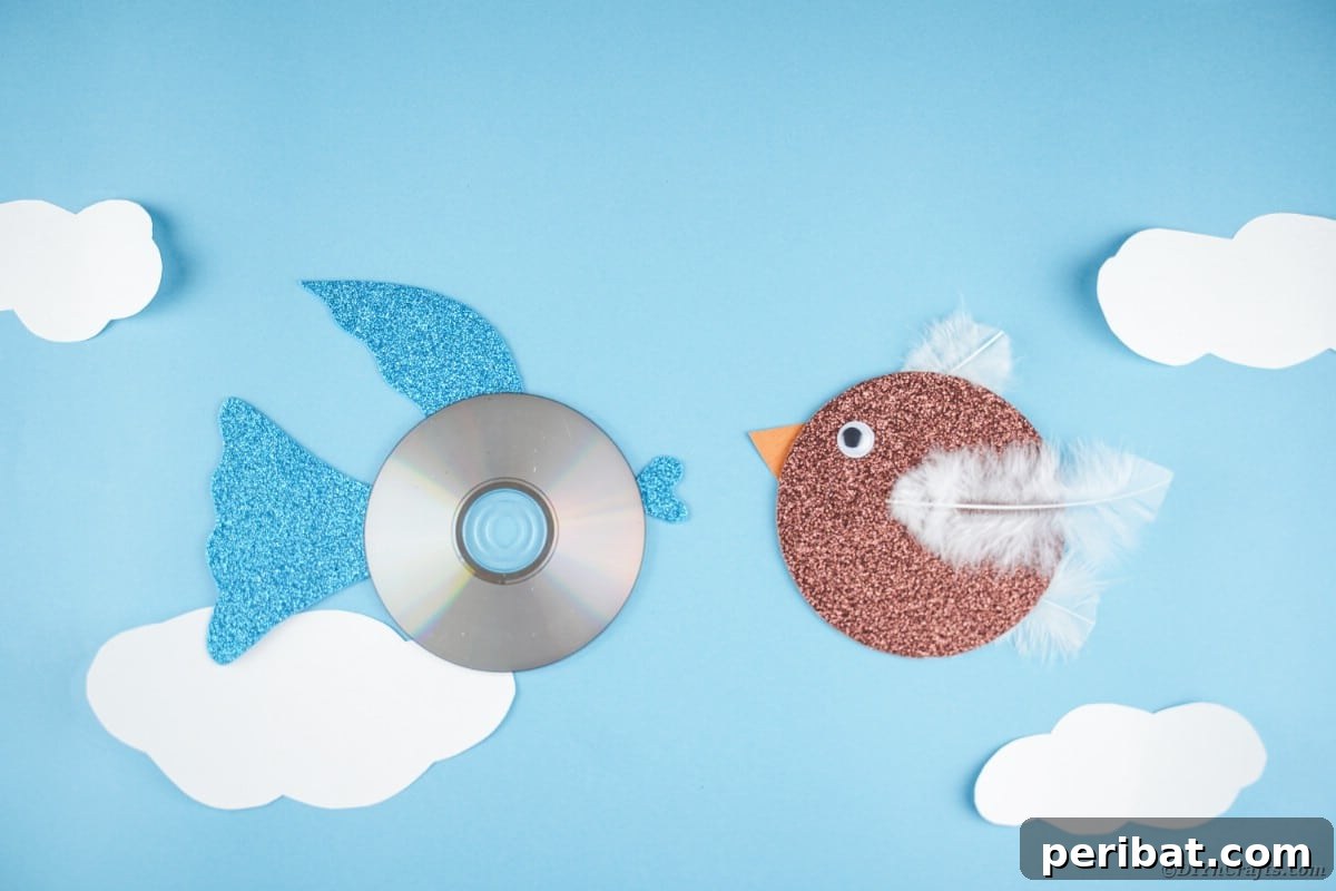 Crafting Whimsical Fish and Bird Decor from Old CDs 2 CD fish and bird on blue paper