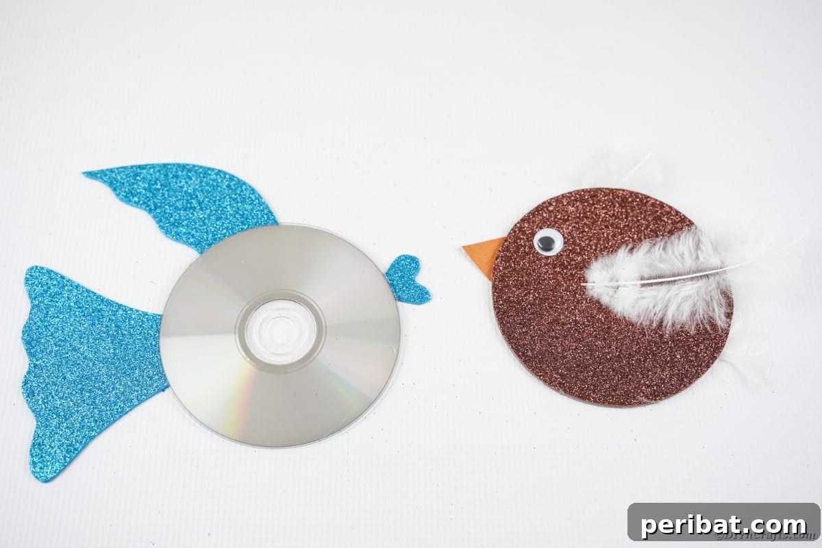 Crafting Whimsical Fish and Bird Decor from Old CDs 19 CD bird and CD fish on white table