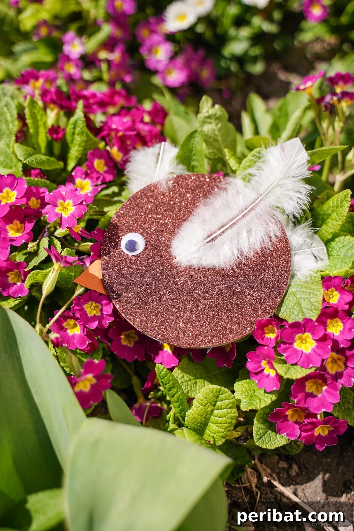 Crafting Whimsical Fish and Bird Decor from Old CDs 3 Brown CD bird on bush with pink flowers