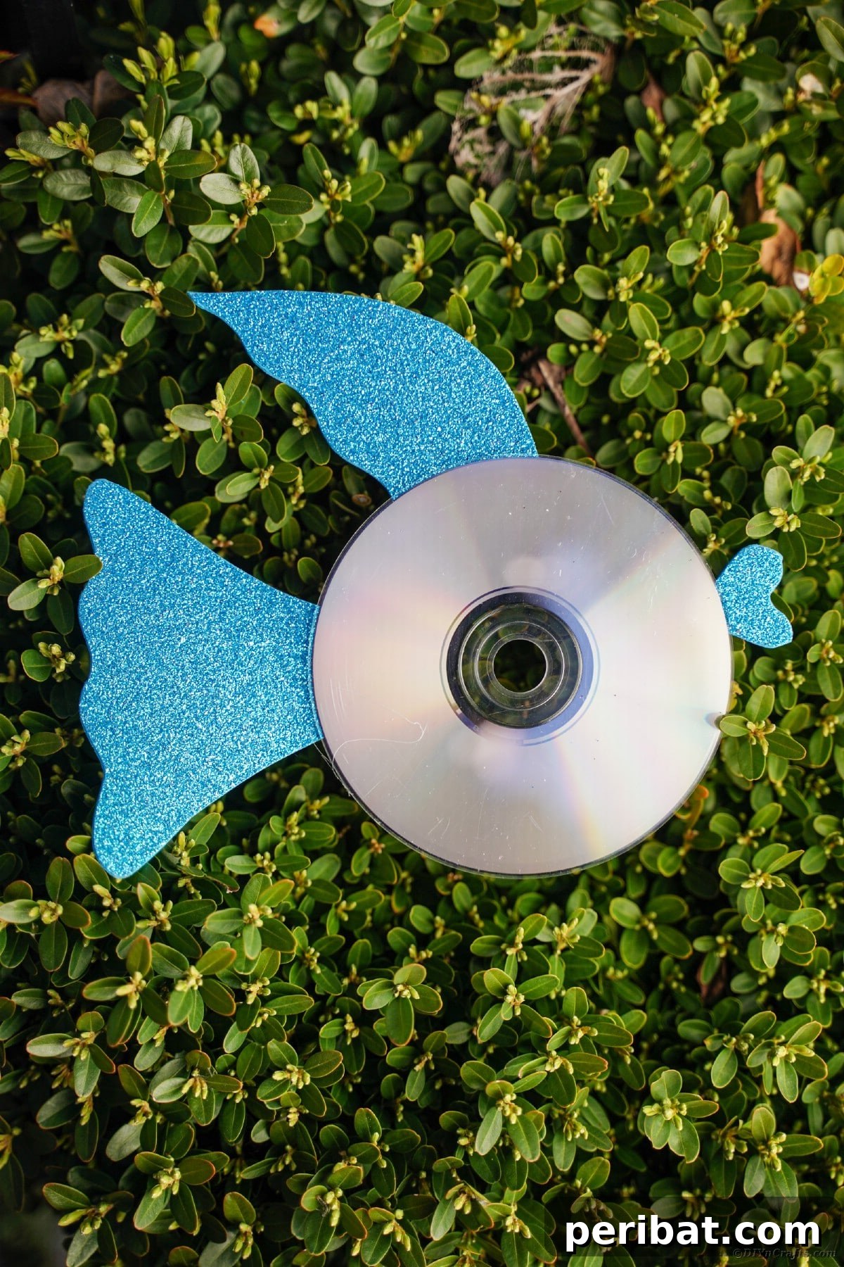 Crafting Whimsical Fish and Bird Decor from Old CDs 24 Blue CD fish on grass