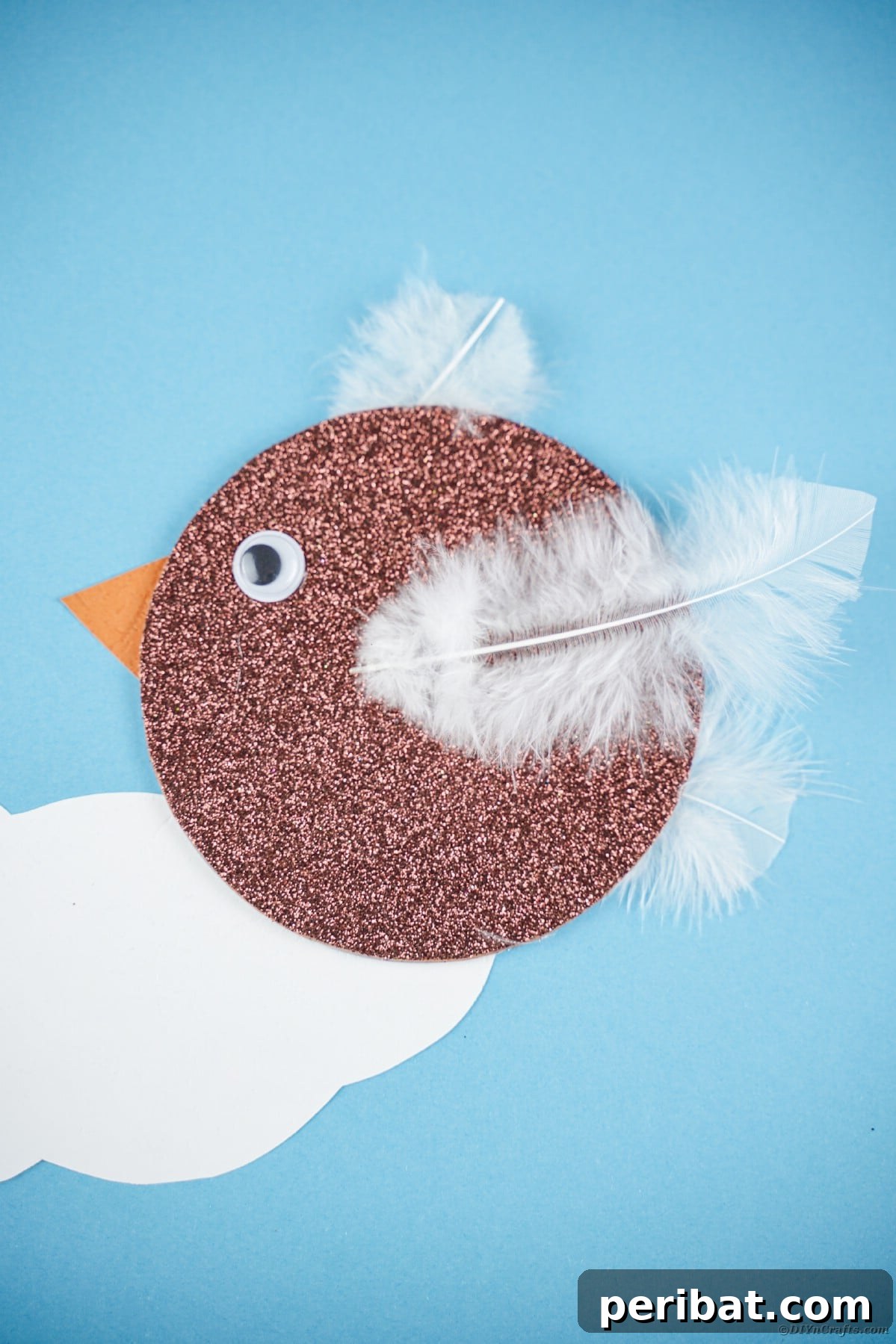 Crafting Whimsical Fish and Bird Decor from Old CDs 8 Brown CD bird on blue paper with clouds