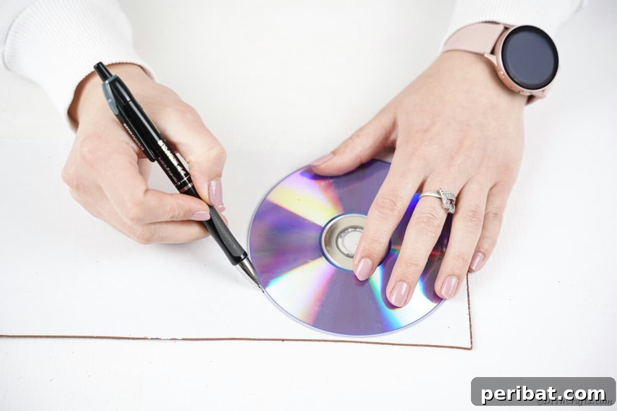 Crafting Whimsical Fish and Bird Decor from Old CDs 10 Tracing circle onto white paper
