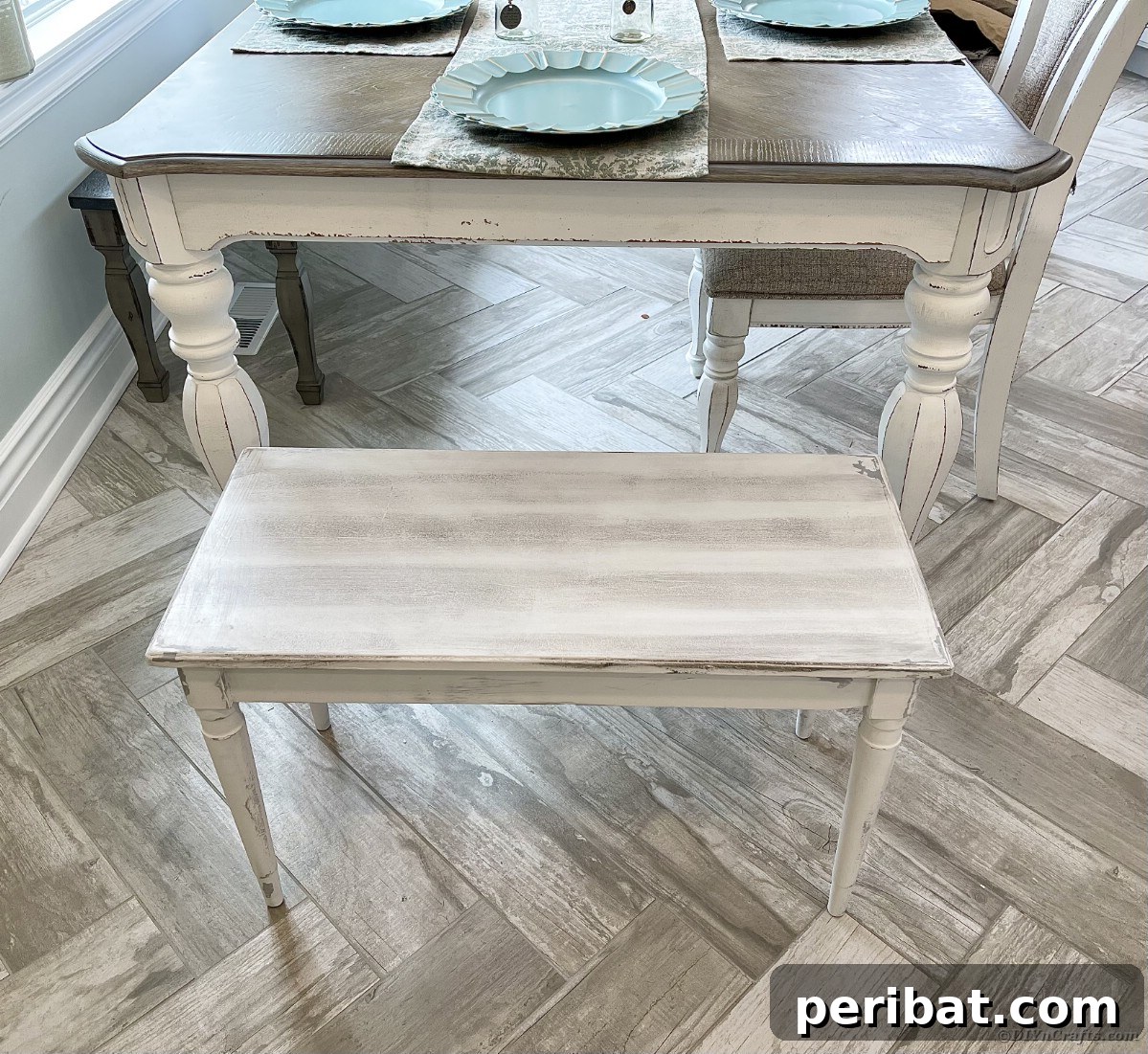 Rustic distressed dining table and bench in a farmhouse setting