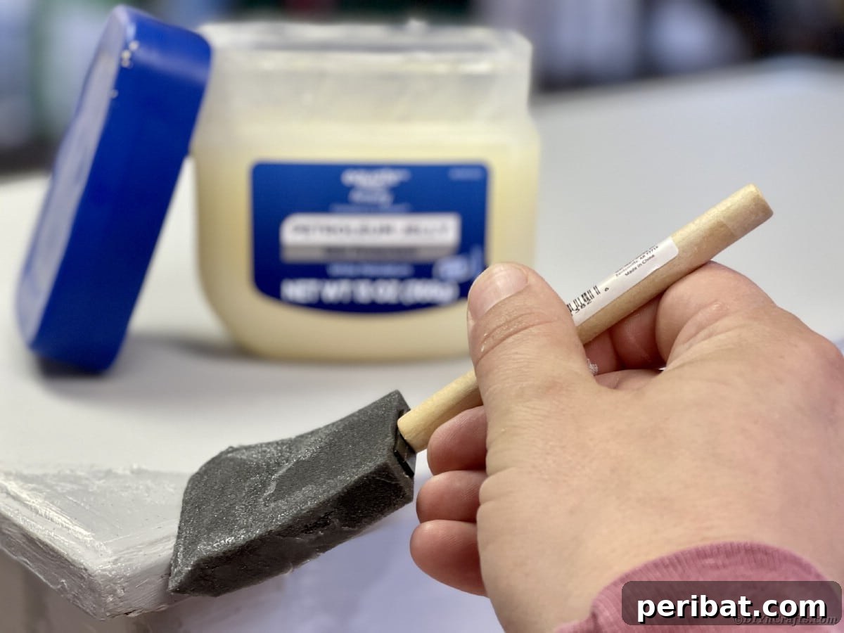 Rubbing petroleum jelly onto specific areas of a wooden bench to create distressed spots