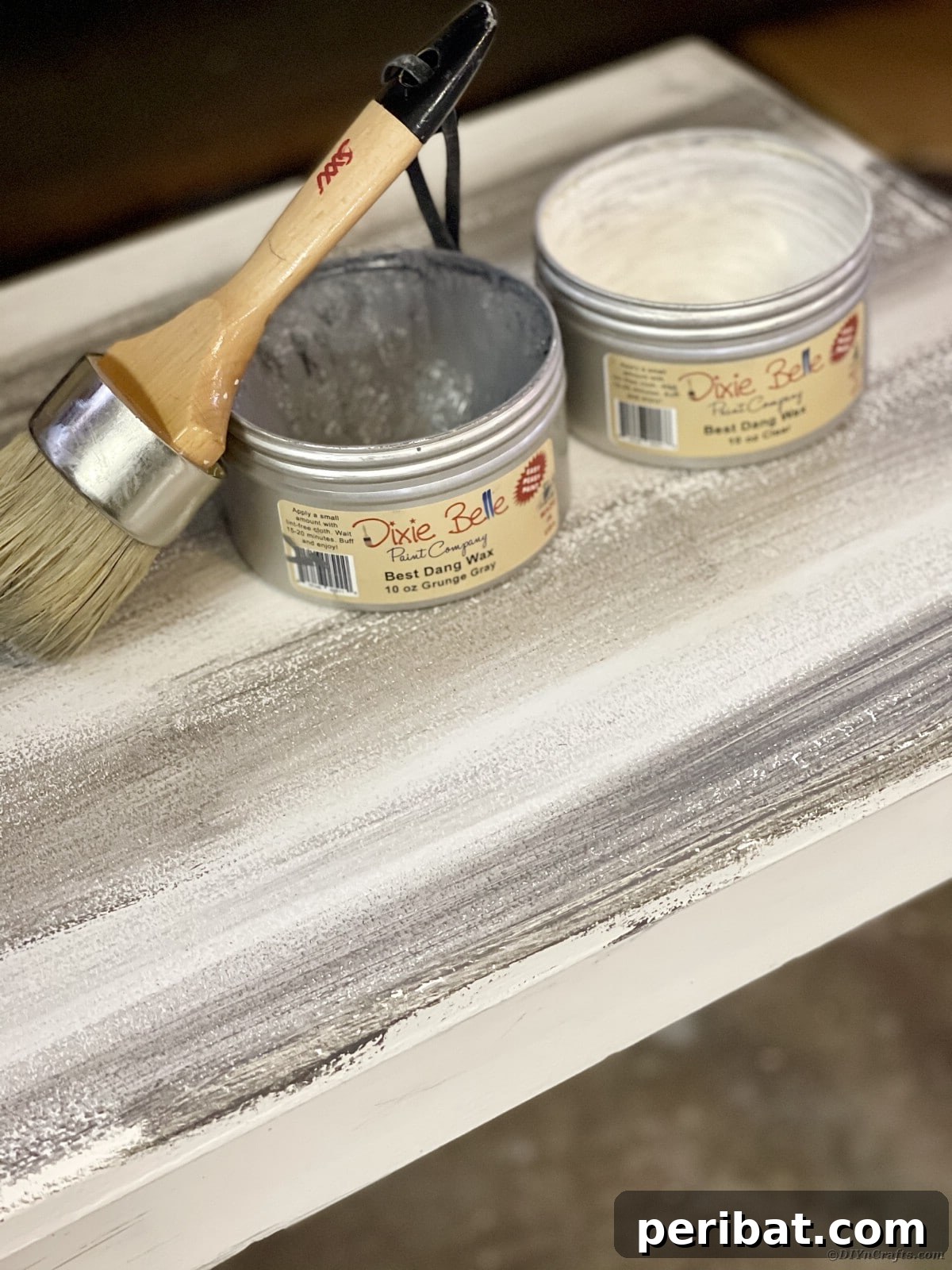 Applying Dixie Belle Clear and Gray Wax to a distressed bench with natural bristle wax brushes