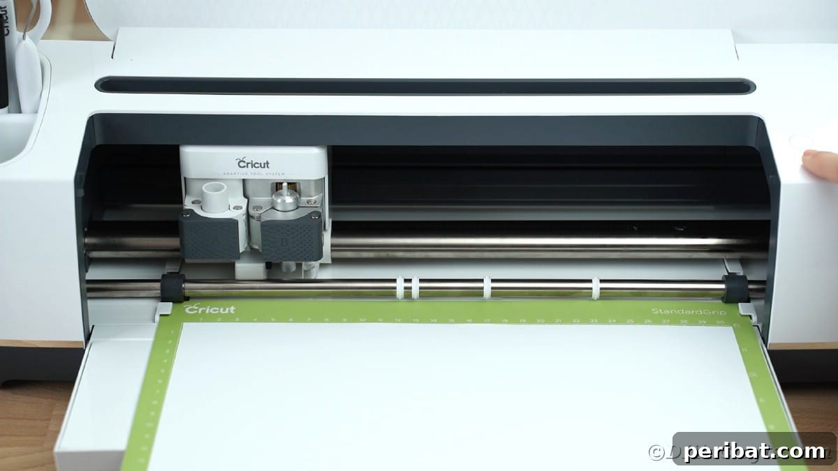 Loading vinyl onto Cricut mat for cutting