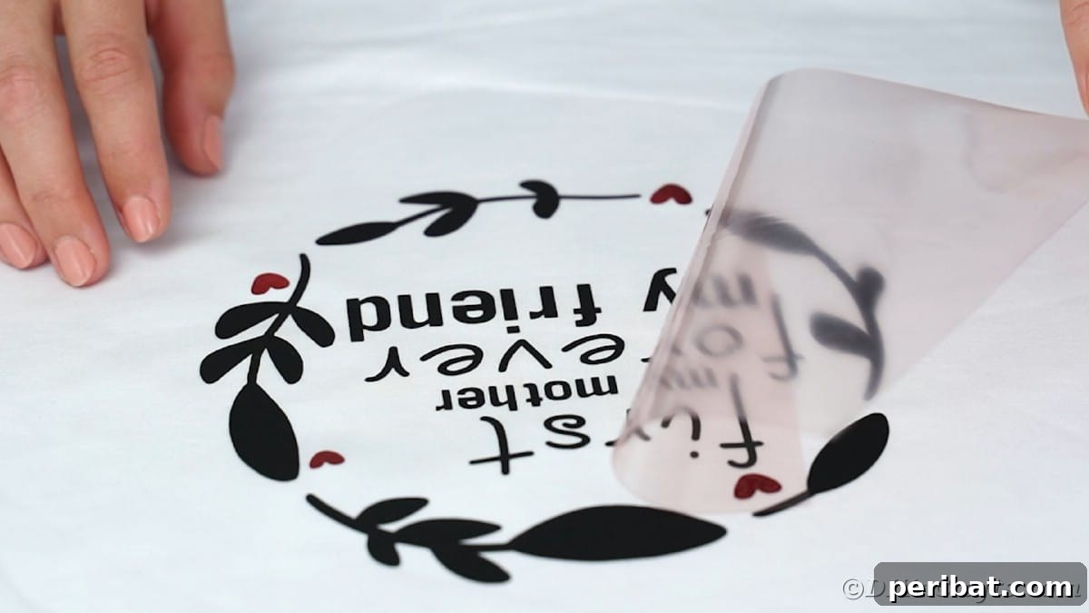 Peeling carrier sheet off vinyl for the 'First Mom Forever Friend' design