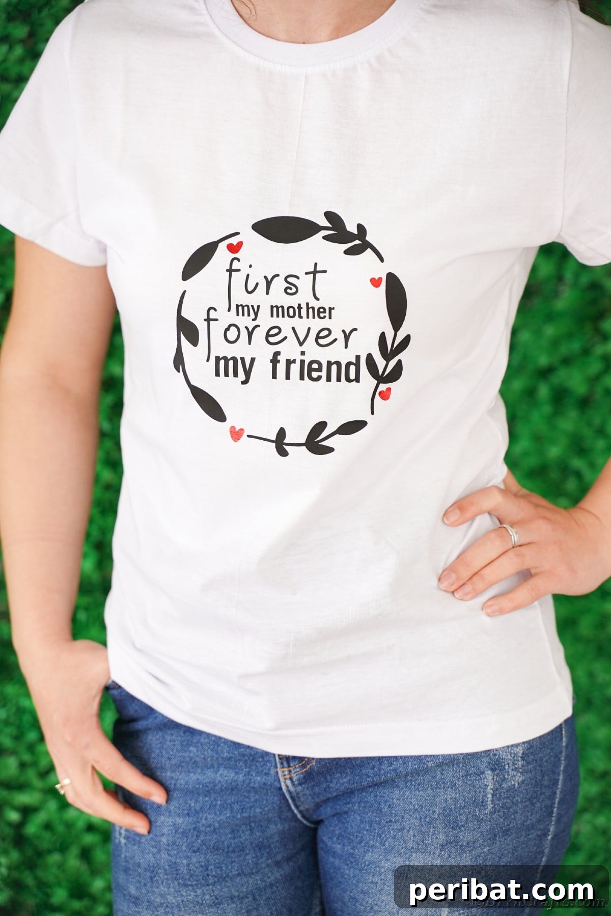 Woman standing wearing a white custom Mother's Day t-shirt with hand on hip