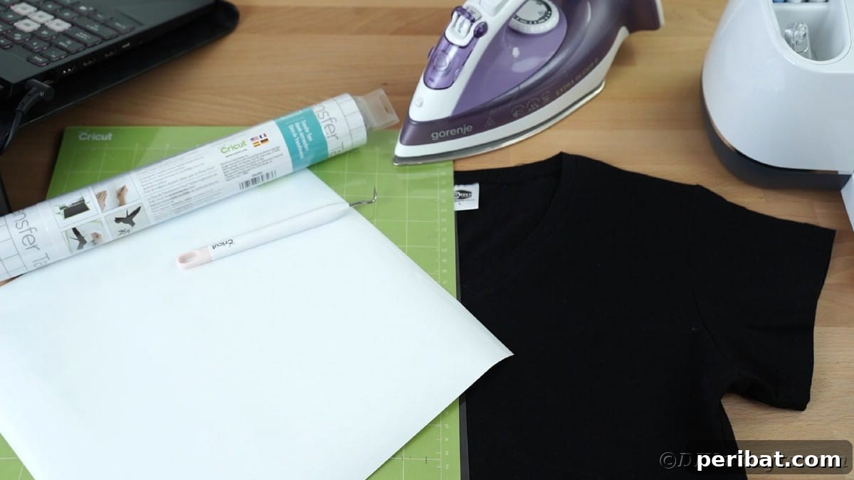 Iron with Cricut mat and black custom t-shirt