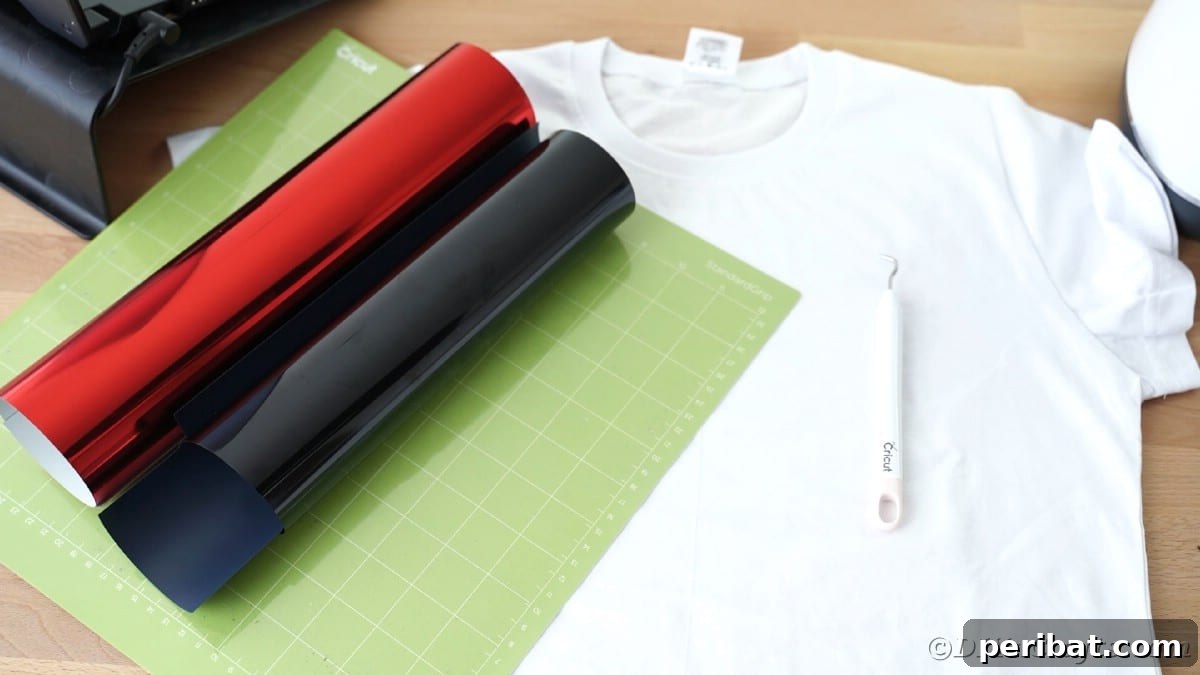 Rolls of black and red vinyl on Cricut mat