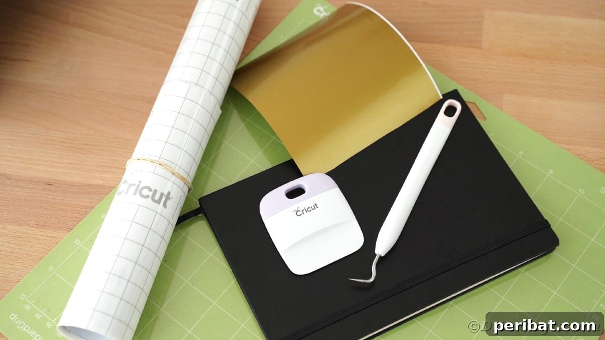 Craft Personalized Vinyl Journals for Mother's Day 11 Green Cricut mat with black book and weeding tool sitting on top
