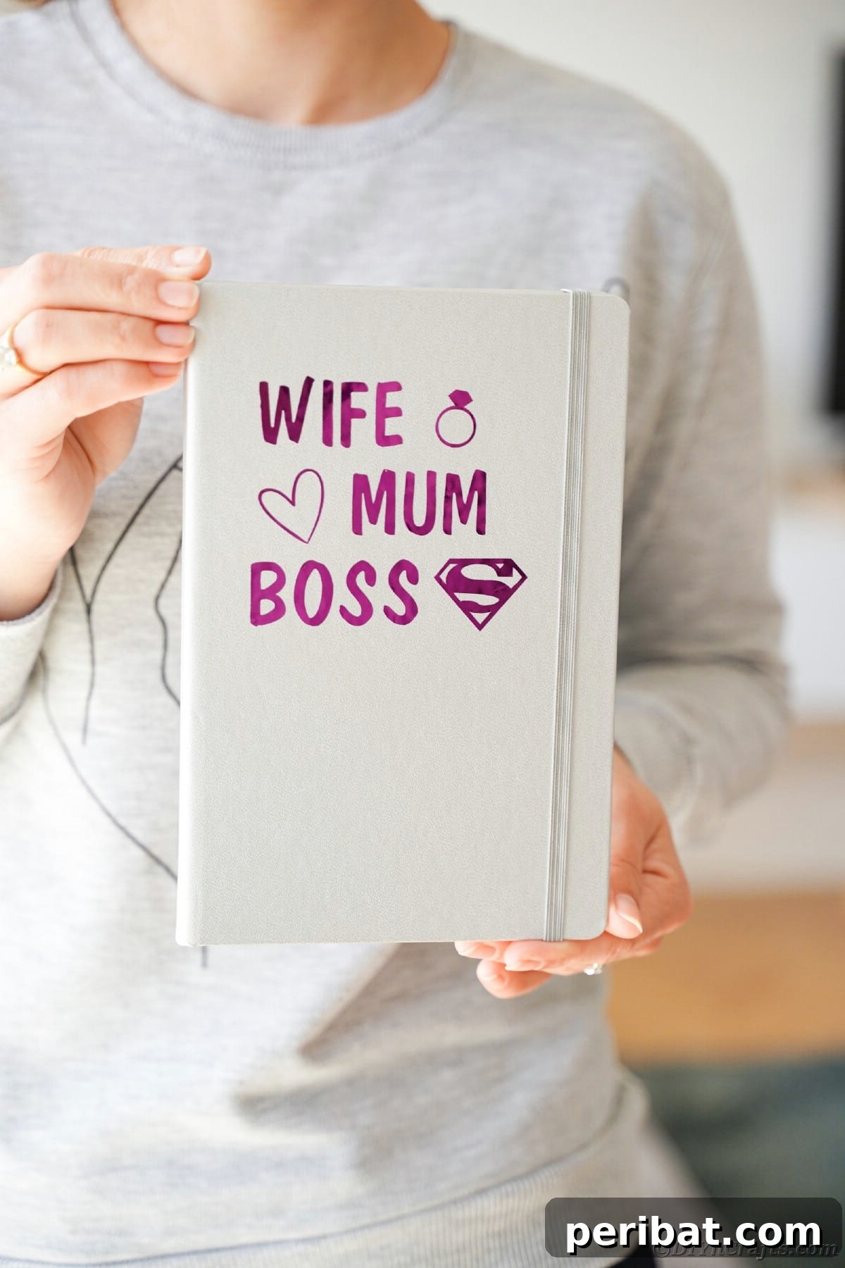 Craft Personalized Vinyl Journals for Mother's Day 16 Woman holding gray journal with purple lettering