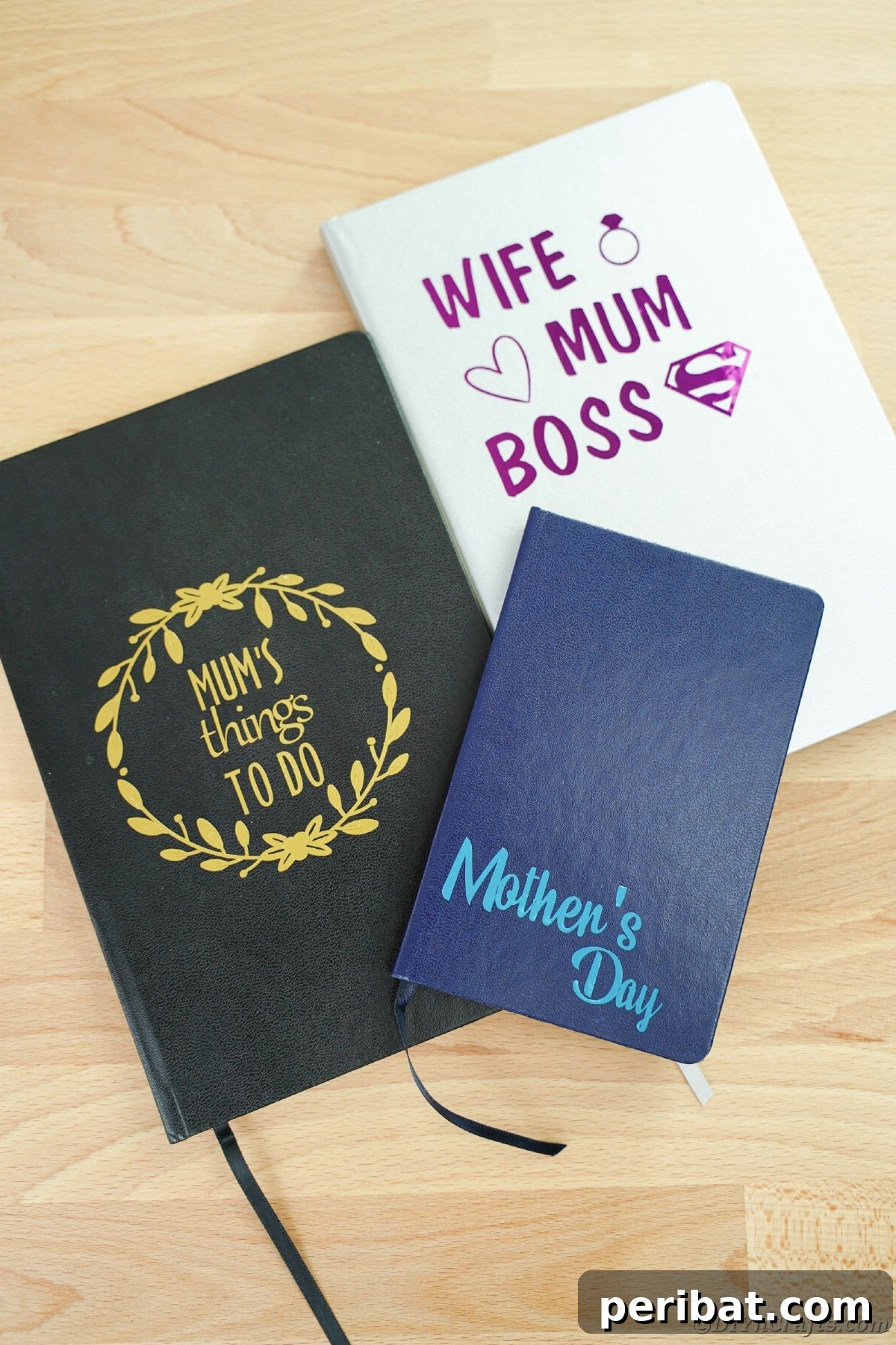 Craft Personalized Vinyl Journals for Mother's Day 18 Stack of journals on wooden table
