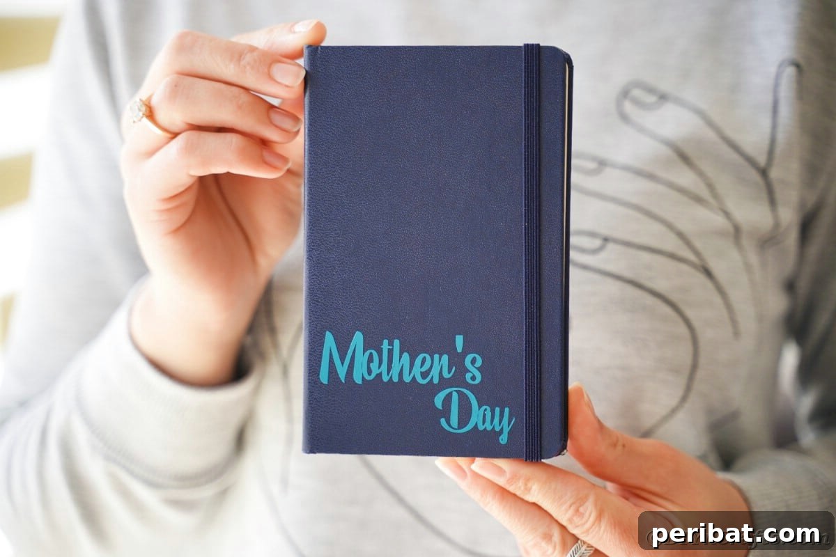 Craft Personalized Vinyl Journals for Mother's Day 7 Woman holding blue journal with 'Mother's Day' on bottom corner