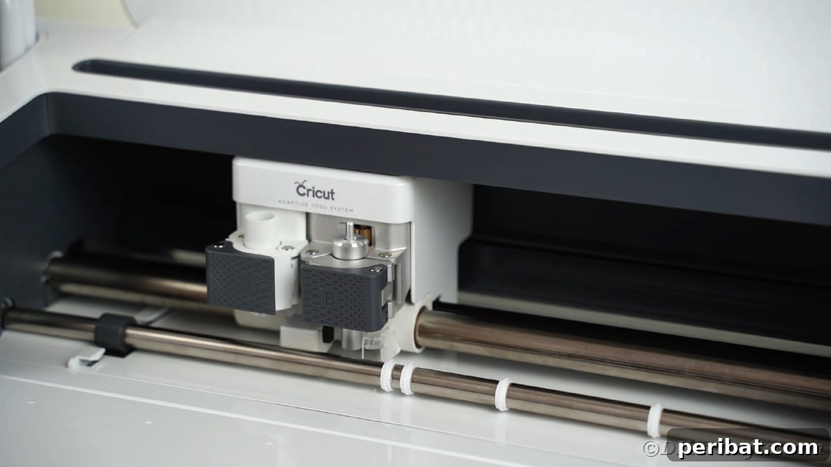 A close-up shot shows a hand carefully loading the blade into a Cricut cutting machine, preparing it for a vinyl cutting project.