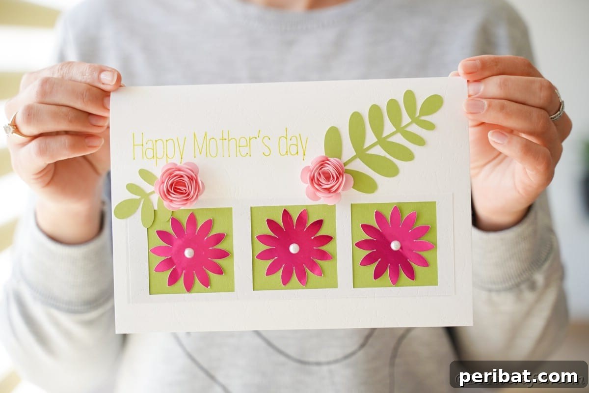 Mothers day card with pink flowers and green leaves
