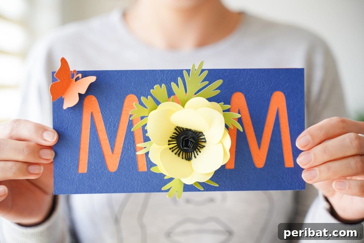 Woman holding blue card with mom and flowers