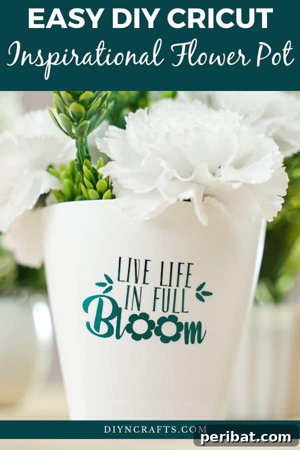 White flower pot on counter with teal message, embodying a minimalist and fresh aesthetic