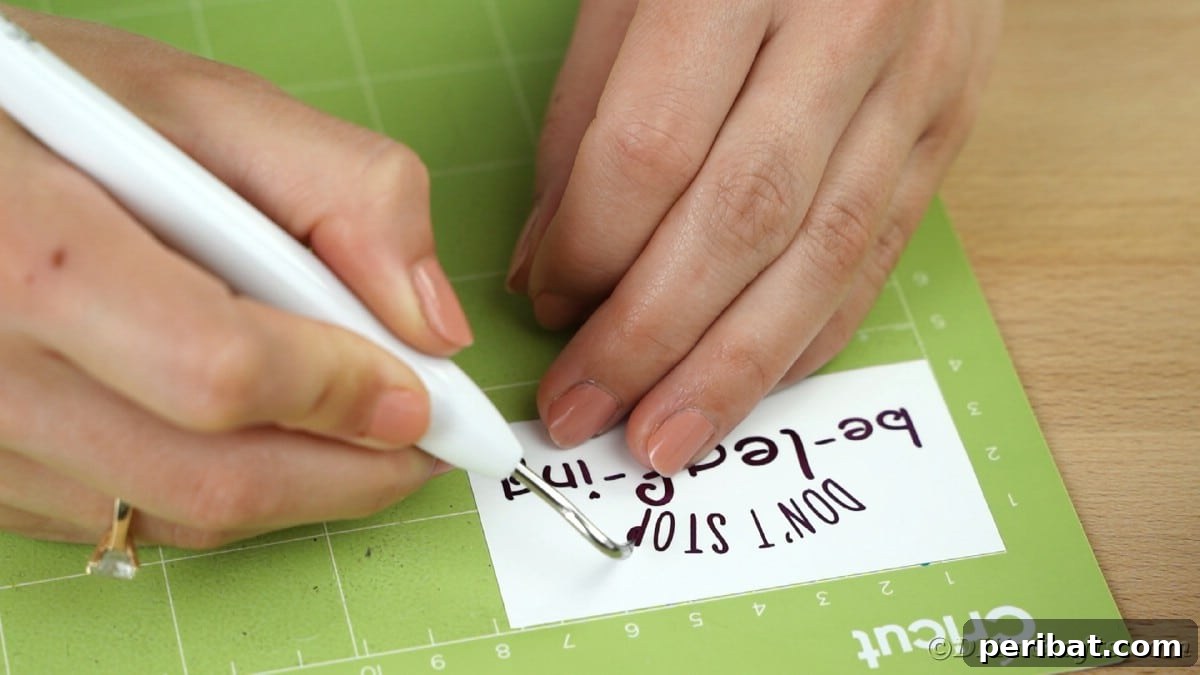 Weeding purple vinyl message on Cricut mat, removing excess pieces
