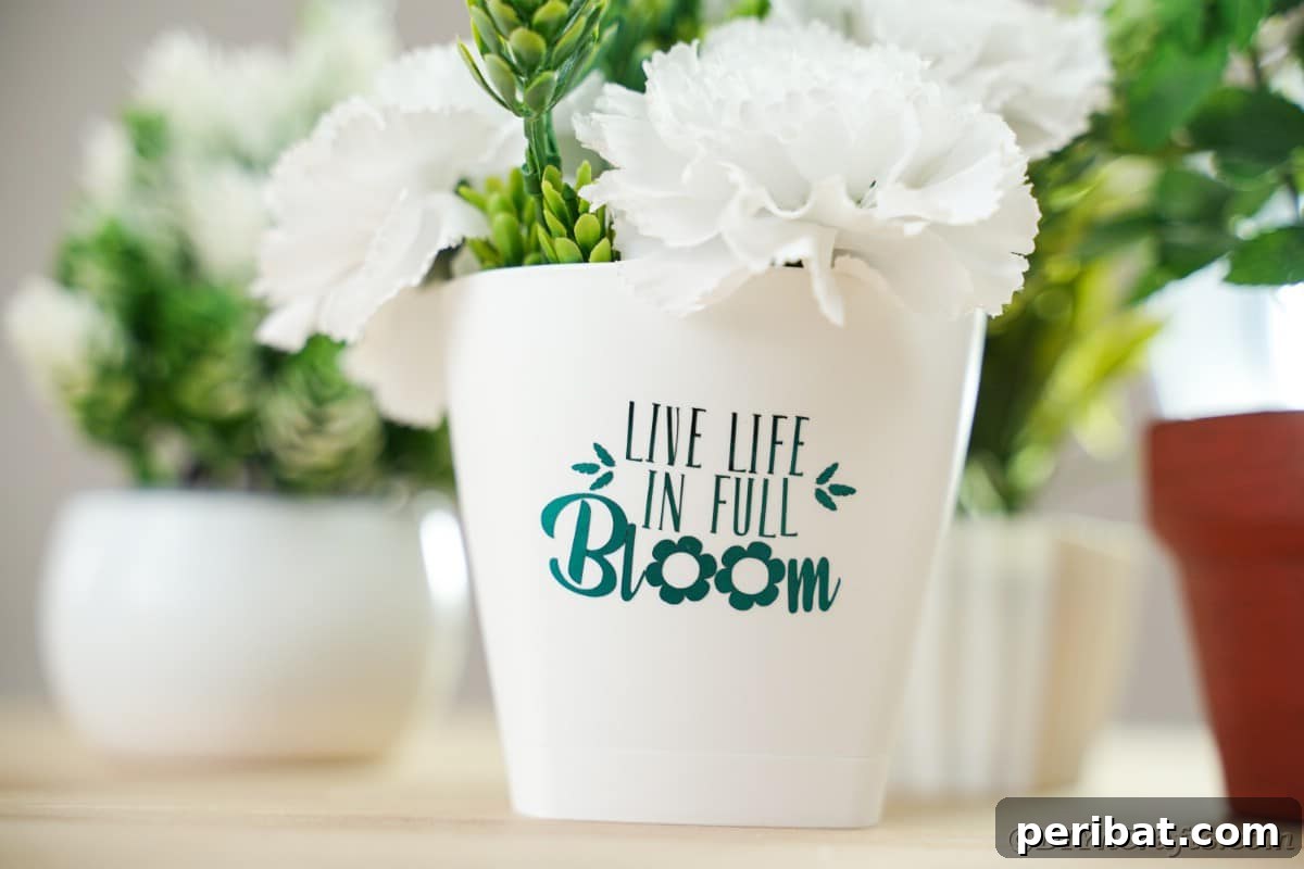 Inspirational flower pot on a table, showcasing a close-up of the vinyl message