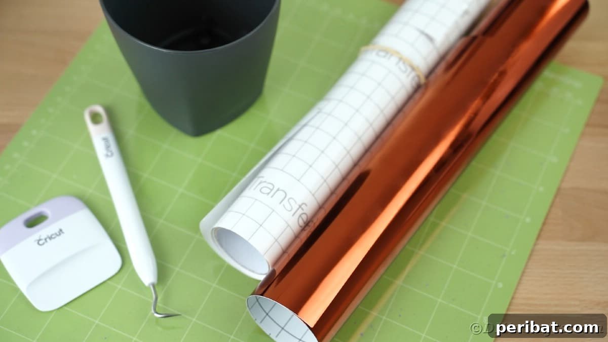 Orange vinyl on green Cricut mat, preparing for a precise cut