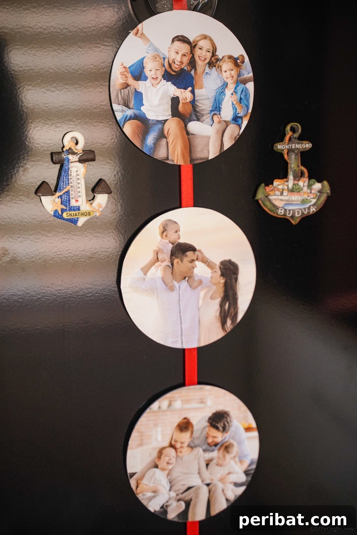 Creative CD Upcycle: DIY Photo Garland for Memories 3 Personalized photo ribbon with anchor magnets adorning a black refrigerator, creating a unique and maritime-themed display of memories.