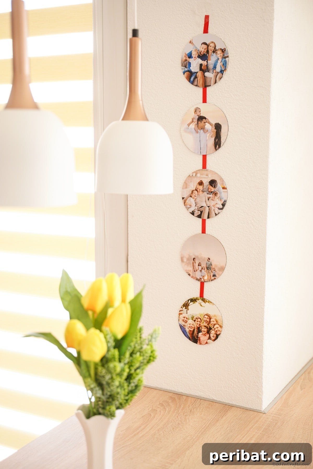 An elegantly designed photo ribbon, showcasing a collection of family pictures, gracefully displayed on a wall above a rustic wooden table, enhancing the room's decor.