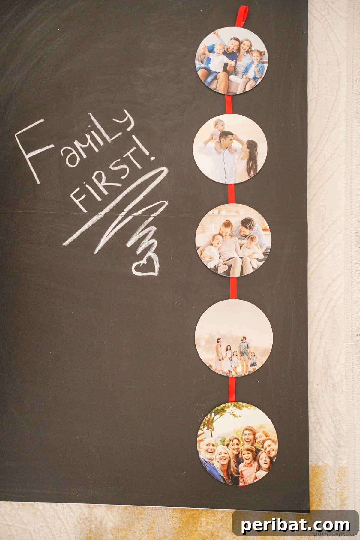A beautifully decorated chalkboard on a wall, complemented by a vibrant red ribbon photo holder displaying cherished family pictures, creating a cozy and personalized atmosphere.