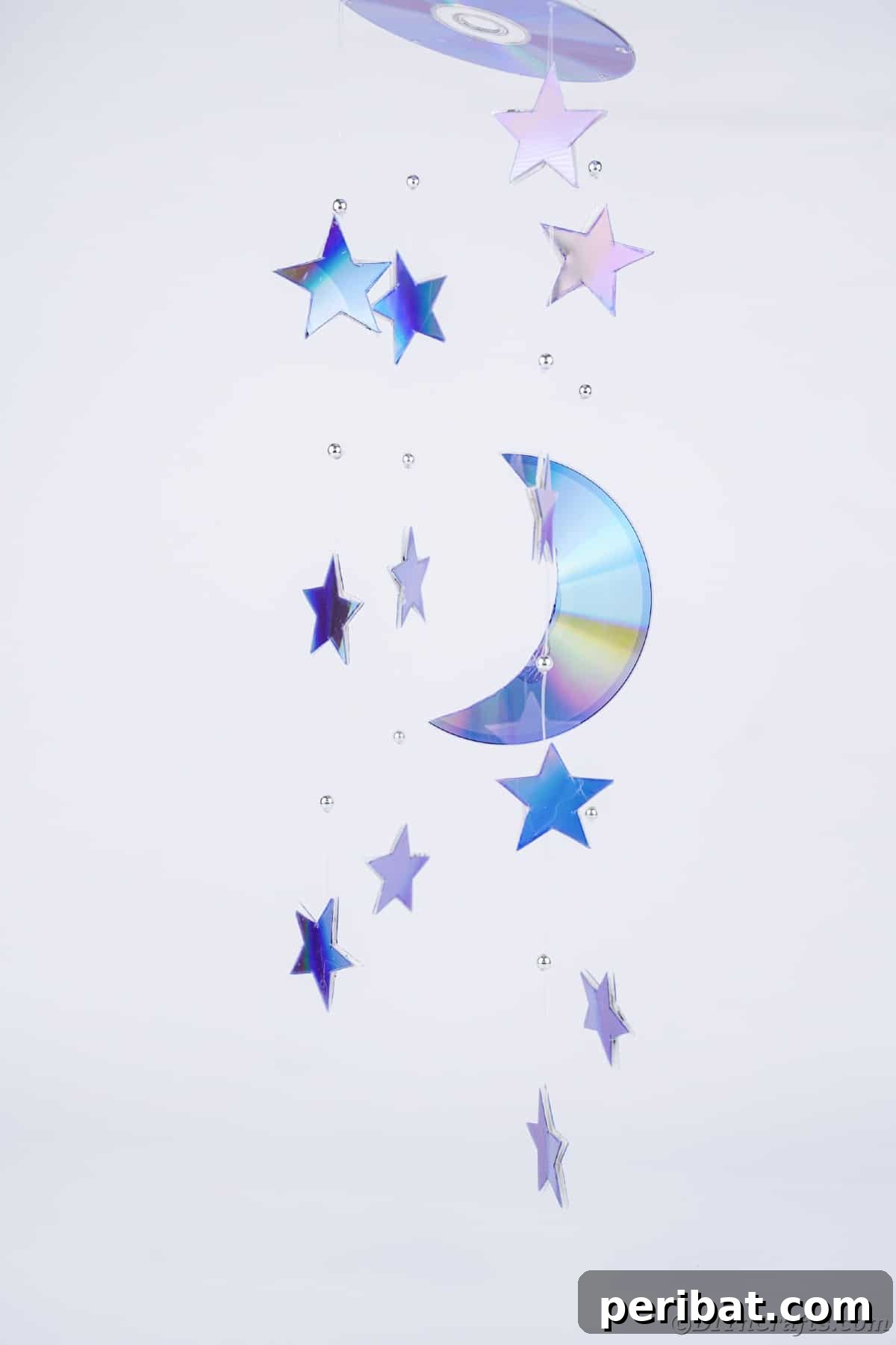 Celestial Sparkle DIY Upcycled CD Moon and Stars Baby Mobile 3 Stars and moon mobile against white wall