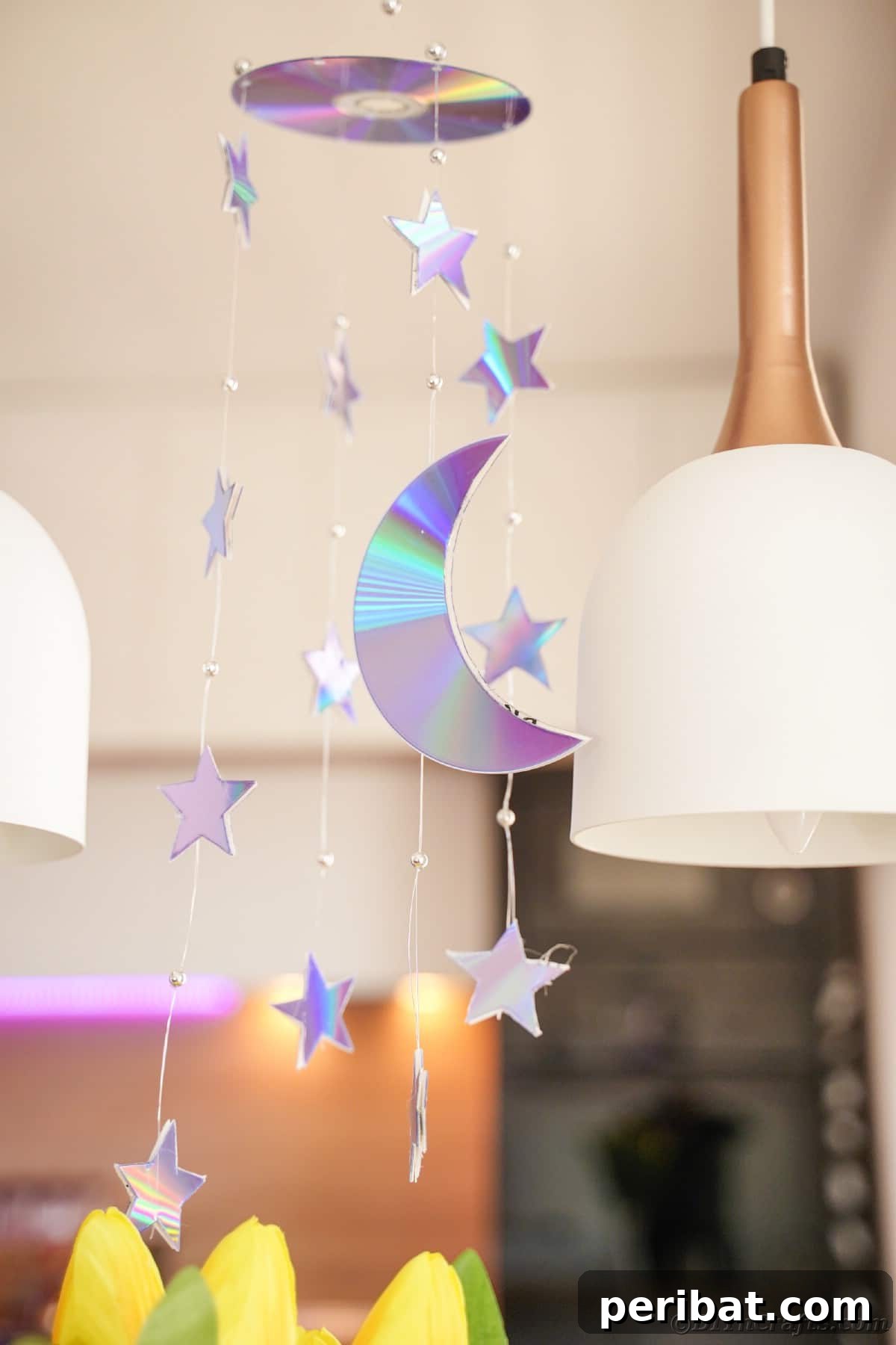 Celestial Sparkle DIY Upcycled CD Moon and Stars Baby Mobile 24 Mobile hanging from ceiling by white lamp