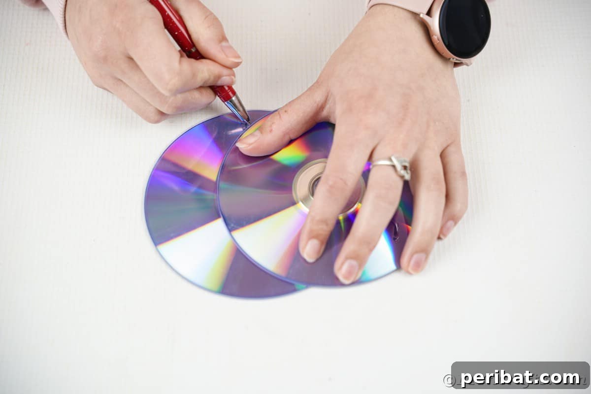 Celestial Sparkle DIY Upcycled CD Moon and Stars Baby Mobile 10 Tracing a moon shape onto a CD