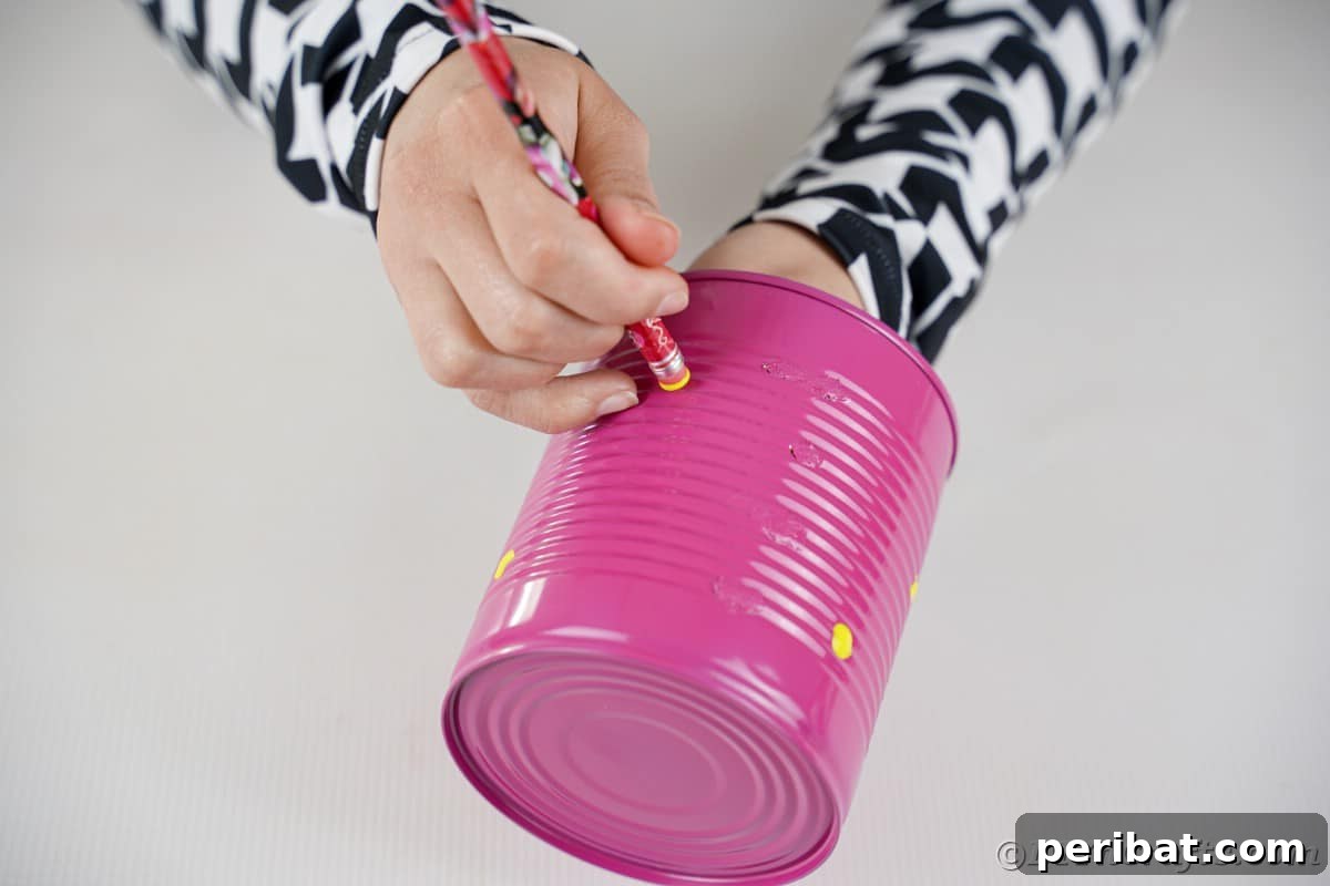 Painting yellow dots on can