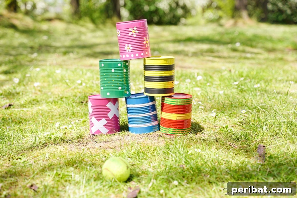 Six tin cans with colorful looks on grass