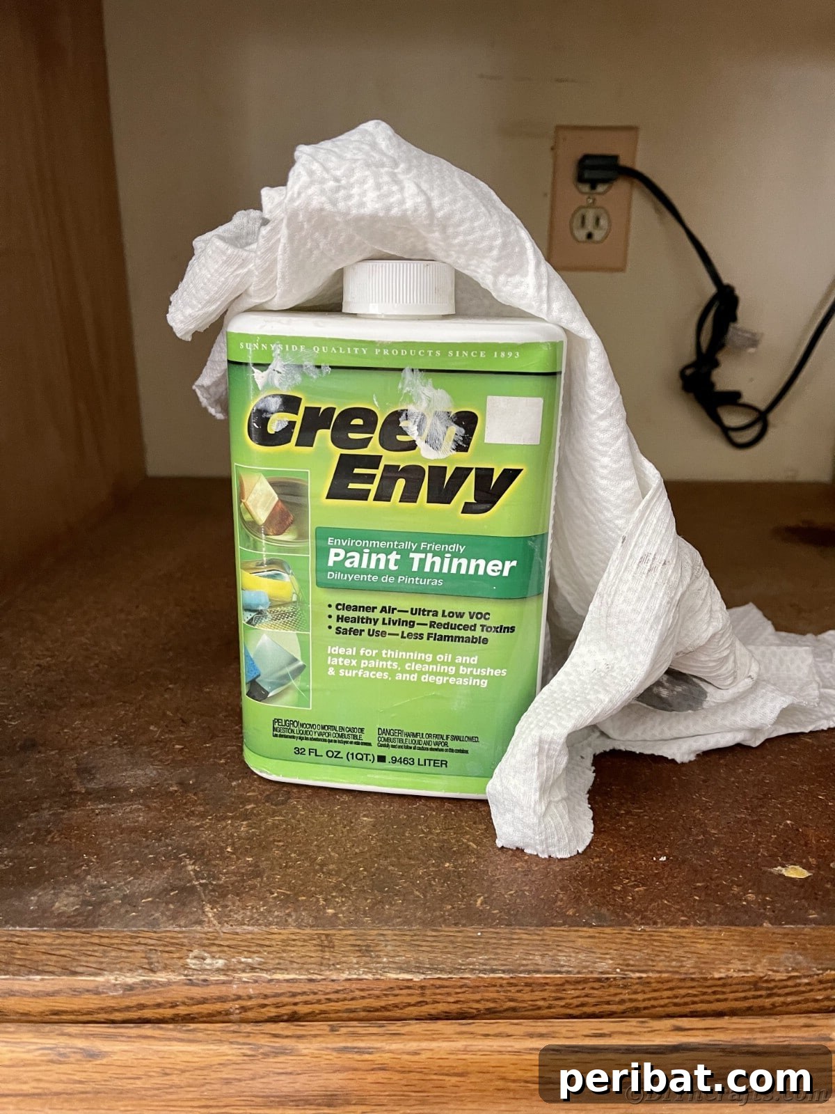 Mineral spirits and rag placed on a kitchen counter, ready for deep cleaning cabinets