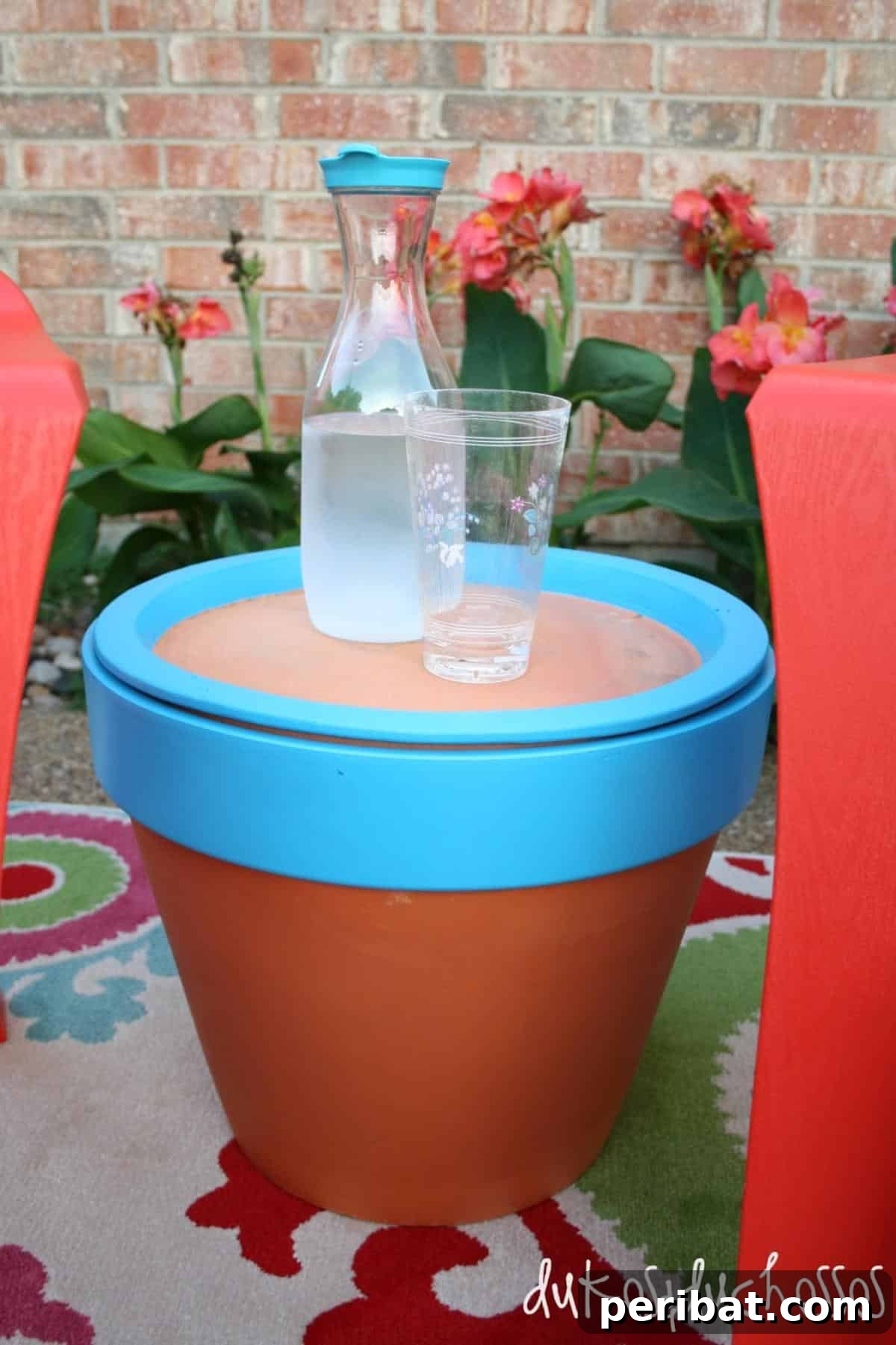 27 Terracotta Crafts to Elevate Your Outdoor Decor 21 DIY Outdoor Table from a pot, showcasing a simple side table created using a large terra cotta pot as a base.