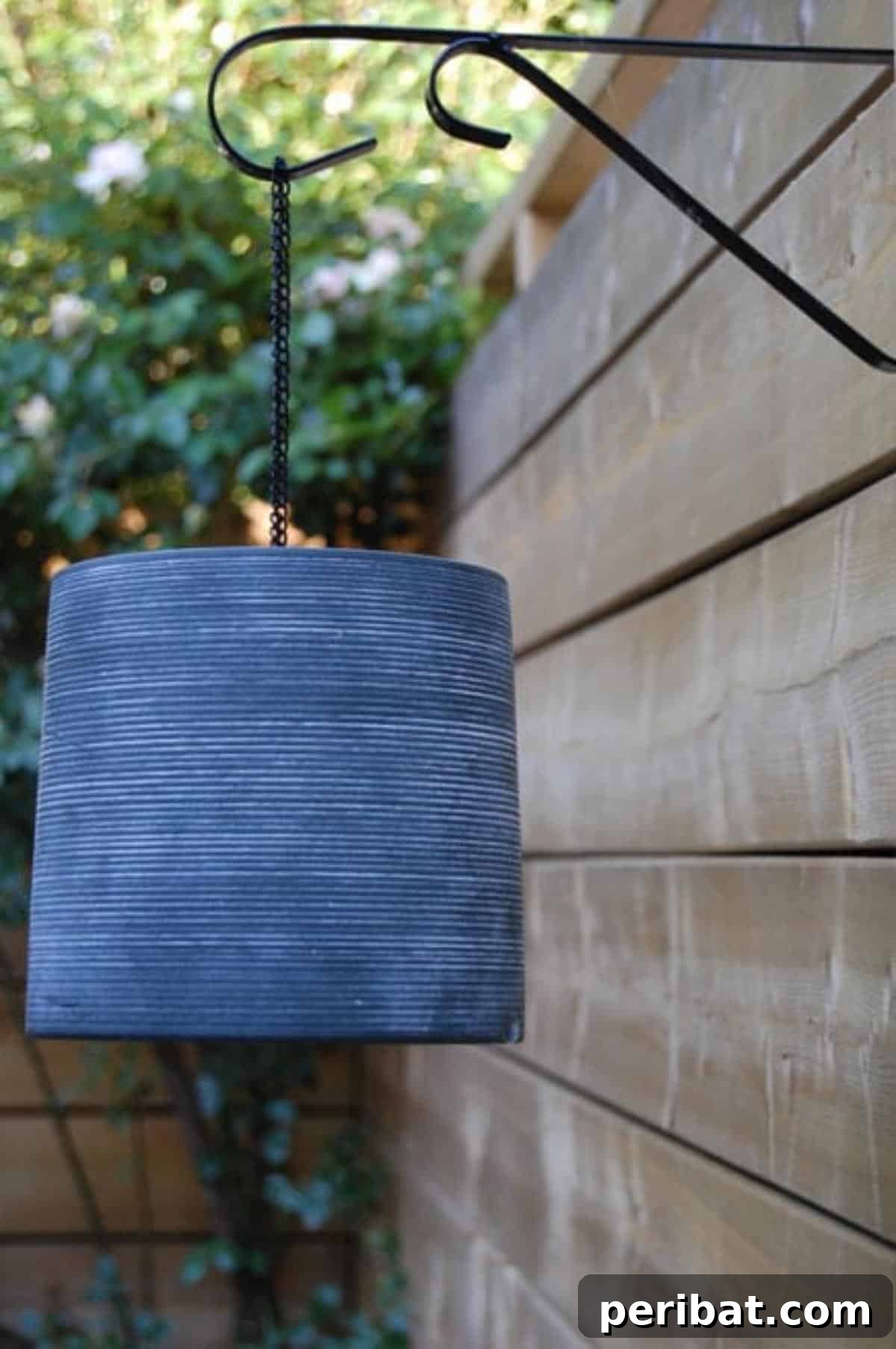 27 Terracotta Crafts to Elevate Your Outdoor Decor 25 DIY Outside Lantern from a pot, a simple and elegant outdoor light made from a terra cotta pot with an LED light.