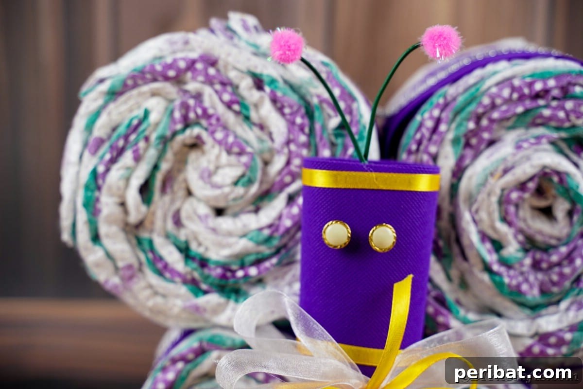 Fluttering Baby Delight: DIY Butterfly Diaper Cake 6 Close-up of the meticulously crafted purple body of a diaper cake butterfly, highlighting the details of this DIY baby gift.