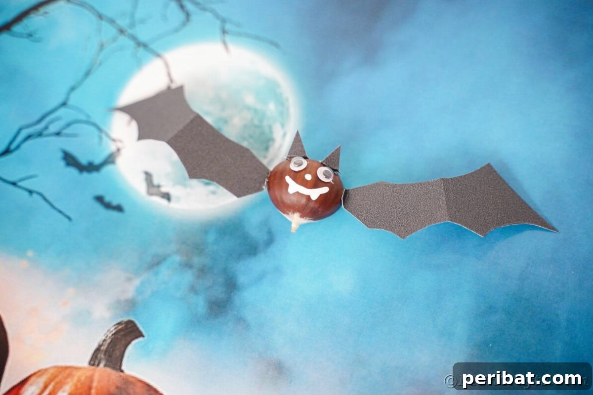 Chestnut bat decoration laying on blue paper
