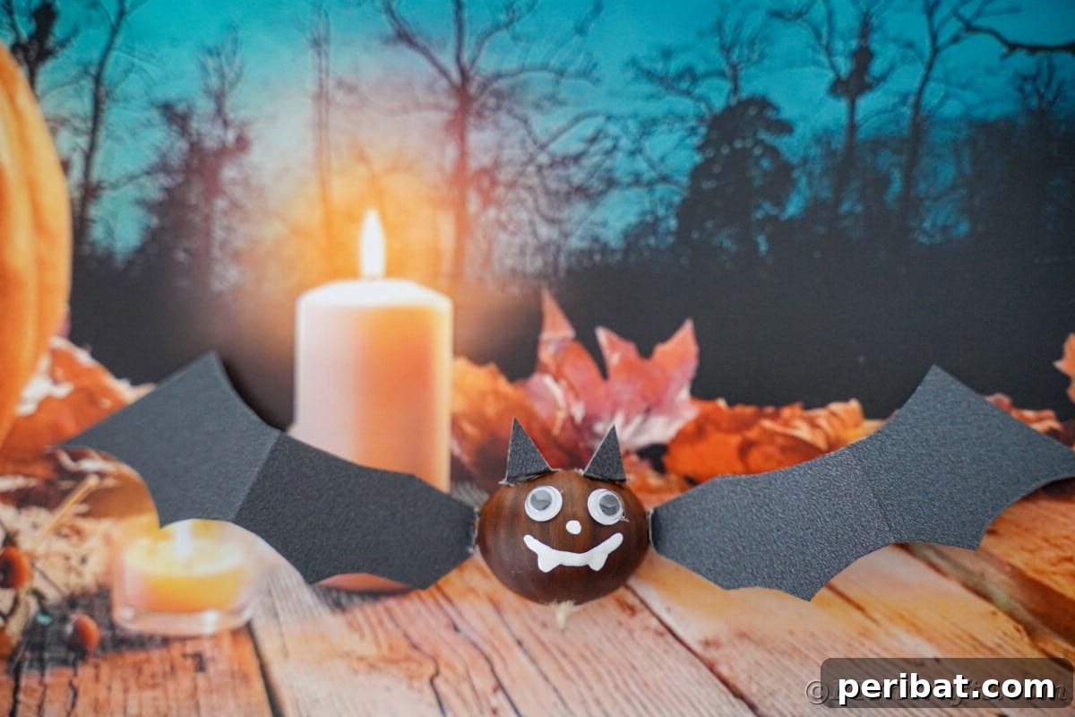 Halloween background with chestnut bat in foreground on table