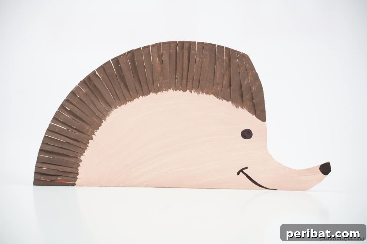 Brown and tan hedgehog from paper plate on white table