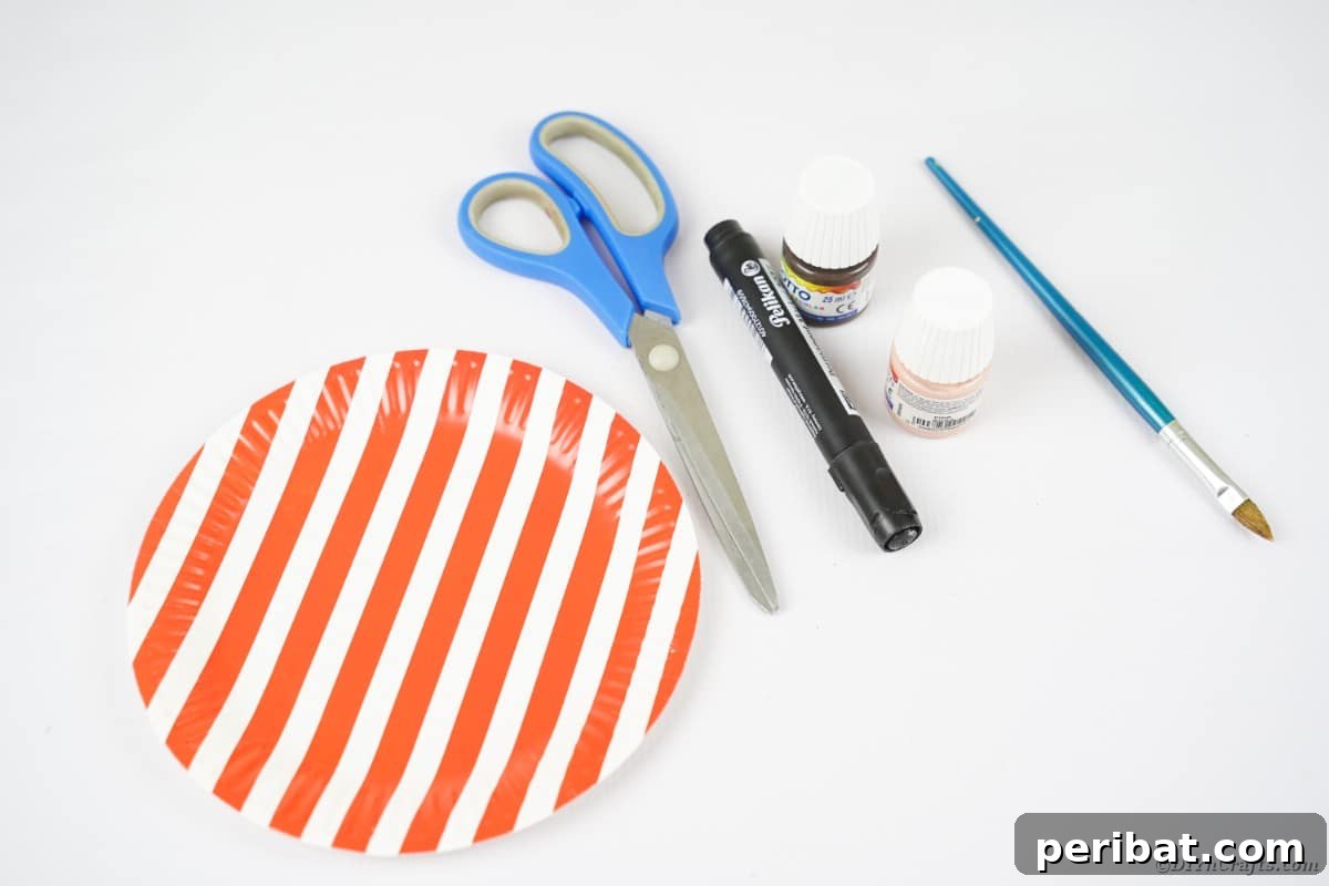 Striped plate with scissors marker and paint on white table