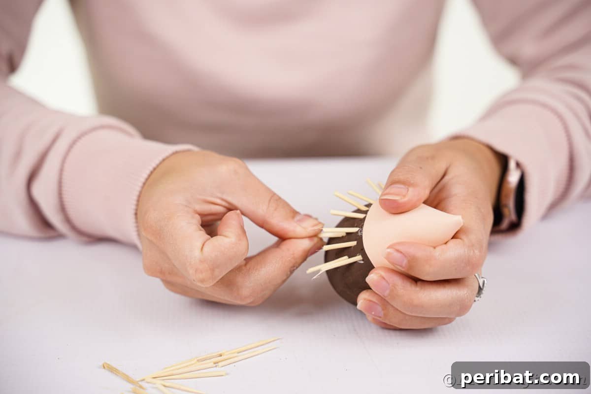 Rustic Foam Hedgehog: An Easy Autumn Craft for Kids 13 Sticking toothpicks into brown egg