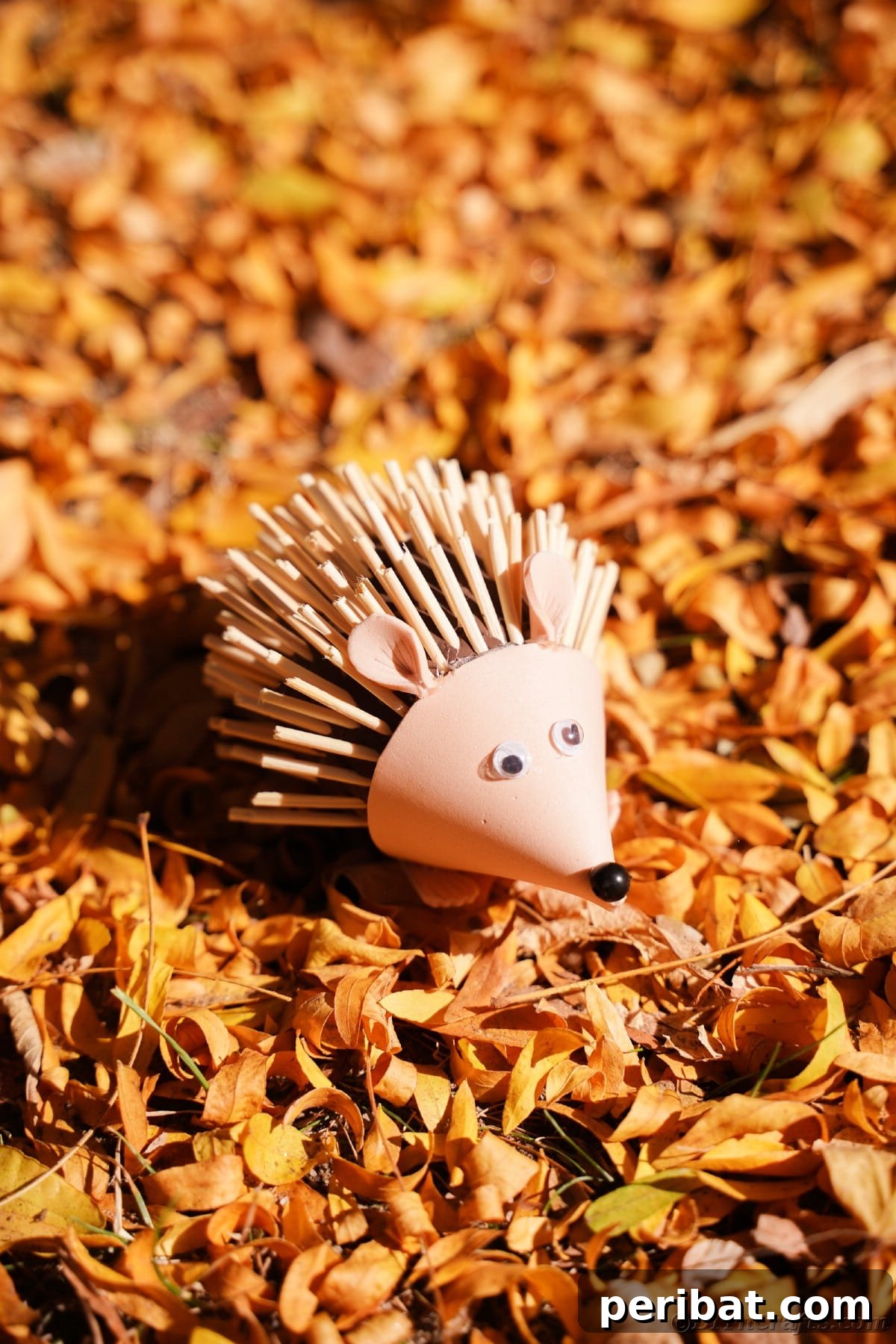 Rustic Foam Hedgehog: An Easy Autumn Craft for Kids 20 Pile of orange leaves with mini foam hedgehog on top