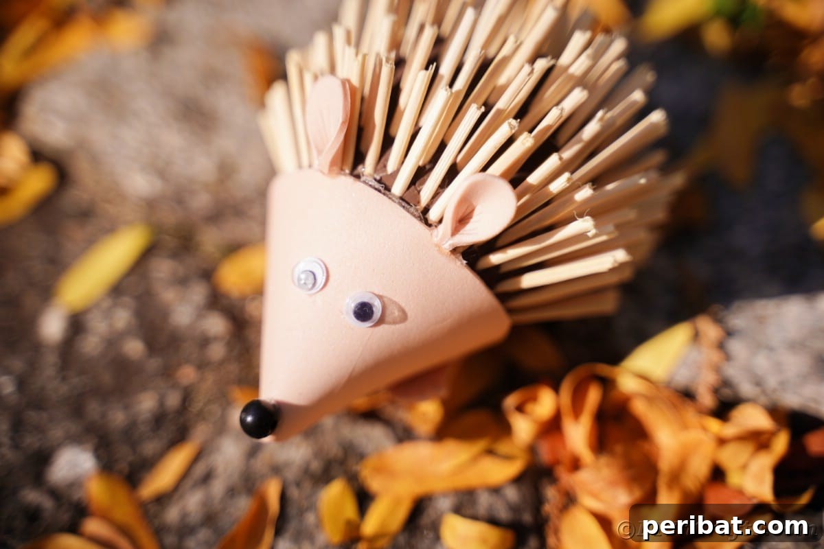 Rustic Foam Hedgehog: An Easy Autumn Craft for Kids 7 Fallen leaves underneath mini hedgehog toy
