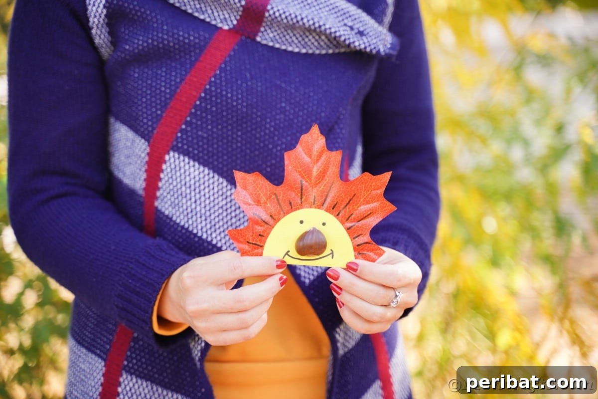 Yellow smiling face on fake leaf being held by woman