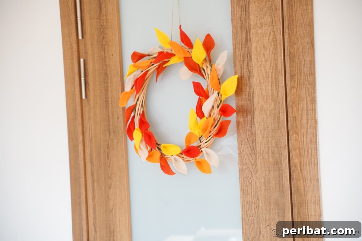 Wood and glass door with fall wreath hanging